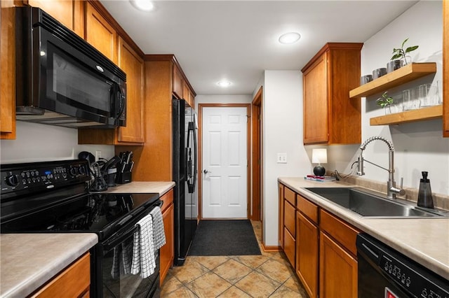 kitchen with open shelves, a sink, light countertops, black appliances, and brown cabinetry