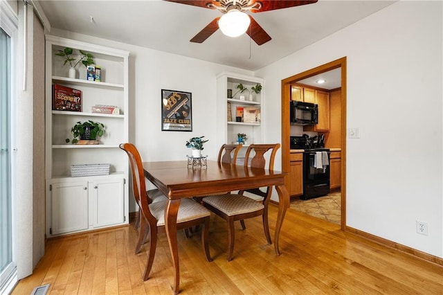 dining area featuring ceiling fan, built in features, visible vents, and light wood-style floors