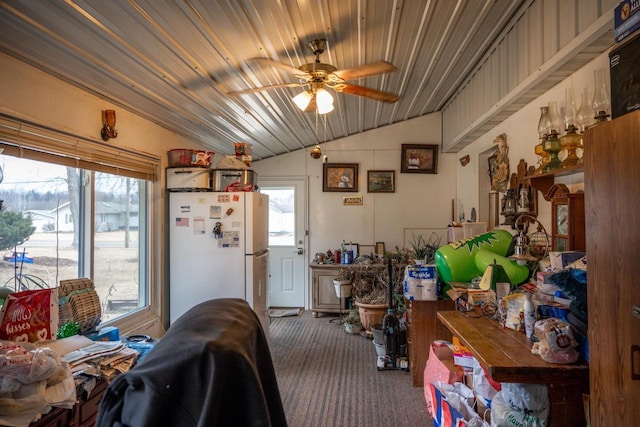 miscellaneous room with lofted ceiling, plenty of natural light, ceiling fan, and carpet flooring