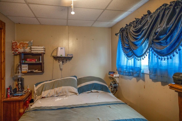 bedroom with a paneled ceiling