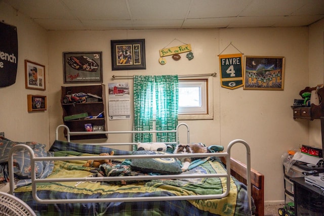 bedroom with a paneled ceiling