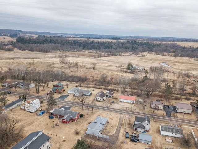 birds eye view of property featuring a rural view