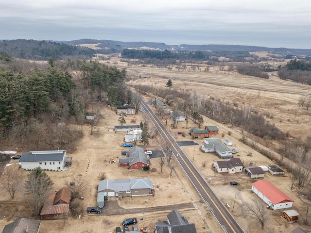 birds eye view of property with a rural view