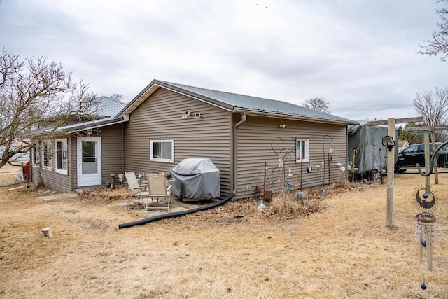 back of property with metal roof