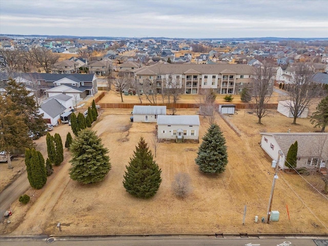 birds eye view of property with a residential view