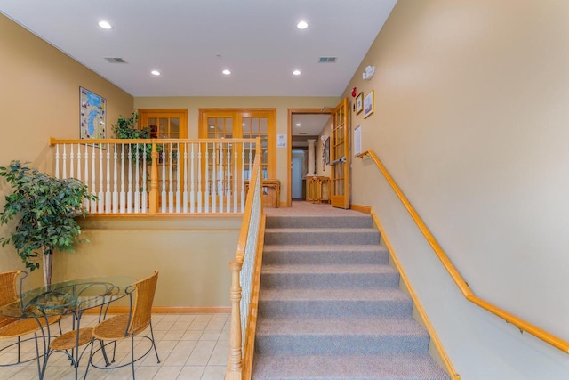 staircase featuring recessed lighting and baseboards