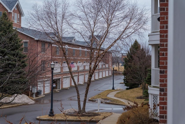 view of side of property with brick siding