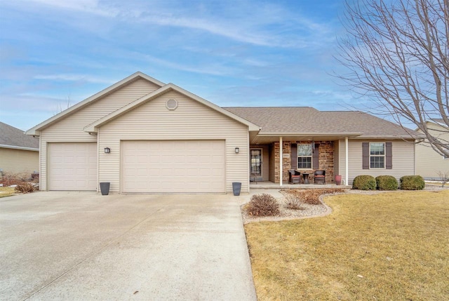 ranch-style home featuring a porch, a garage, driveway, roof with shingles, and a front lawn