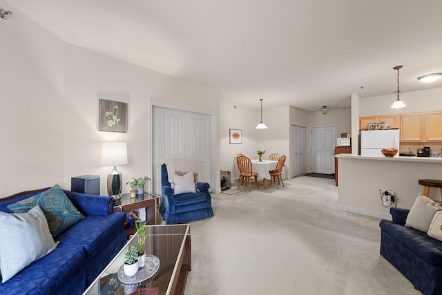 living room featuring baseboards and light colored carpet