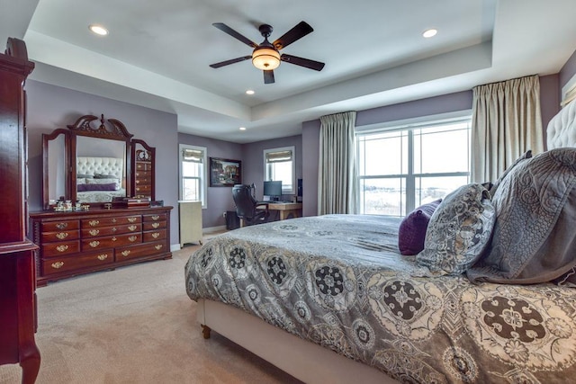 bedroom featuring baseboards, a tray ceiling, carpet, and recessed lighting