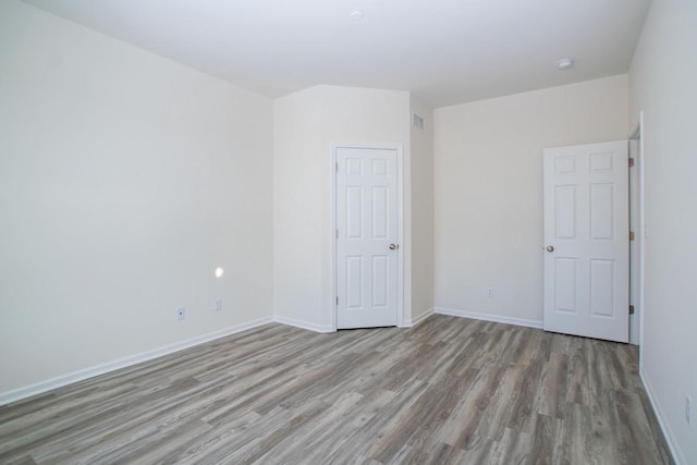 412 Kensington Ct Unit Lt142Grant, Williams Bay, WI 53191 - unfurnished bedroom featuring baseboards and wood finished floors