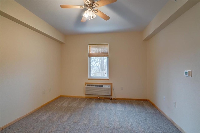 carpeted spare room with ceiling fan, baseboards, and a wall mounted AC