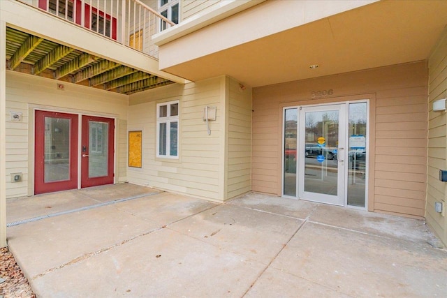 property entrance with french doors and a patio