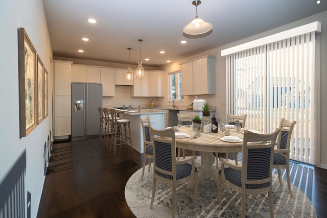 dining space with dark wood-style floors and recessed lighting