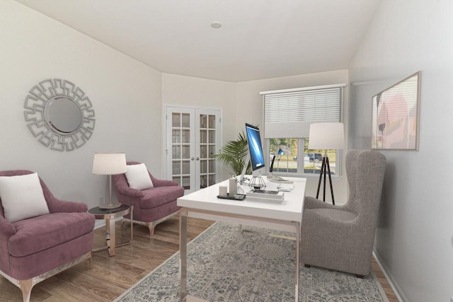 home office with baseboards, wood finished floors, and french doors