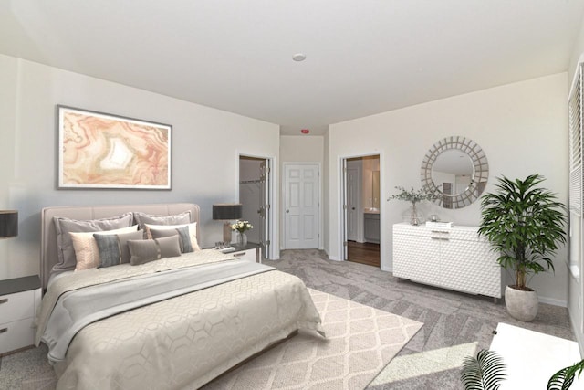 bedroom with baseboards, connected bathroom, and light colored carpet