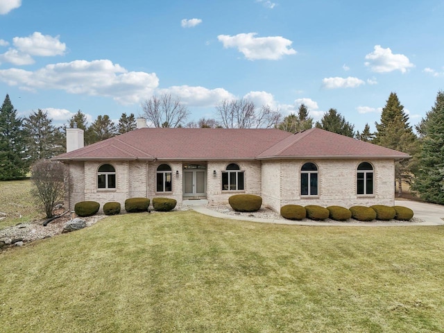 4707 Plainfield Ct, Middleton, WI 53562 - single story home with a front yard, brick siding, and a chimney