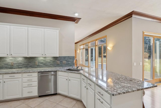 4707 Plainfield Ct, Middleton, WI 53562 - kitchen featuring tasteful backsplash, a peninsula, white cabinets, dishwasher, and a sink