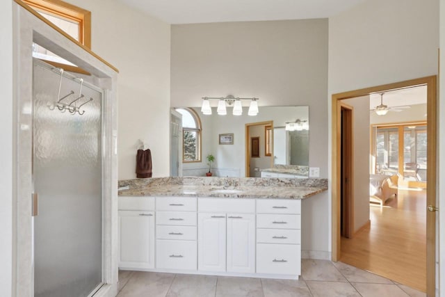 4707 Plainfield Ct, Middleton, WI 53562 - bathroom featuring tile patterned floors, vanity, a towering ceiling, and a ceiling fan