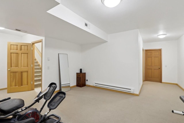 4707 Plainfield Ct, Middleton, WI 53562 - exercise area with a baseboard heating unit, baseboards, visible vents, and carpet floors