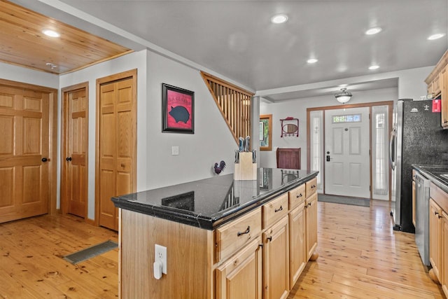 W3084 Blackbird Point Dr, Green Lake, WI 53946 - kitchen featuring recessed lighting, light wood-type flooring, a kitchen island, appliances with stainless steel finishes, and dark stone countertops