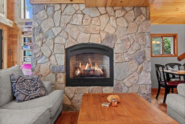W3084 Blackbird Point Dr, Green Lake, WI 53946 - detailed view of wood finished floors, wooden ceiling, a fireplace, and baseboards