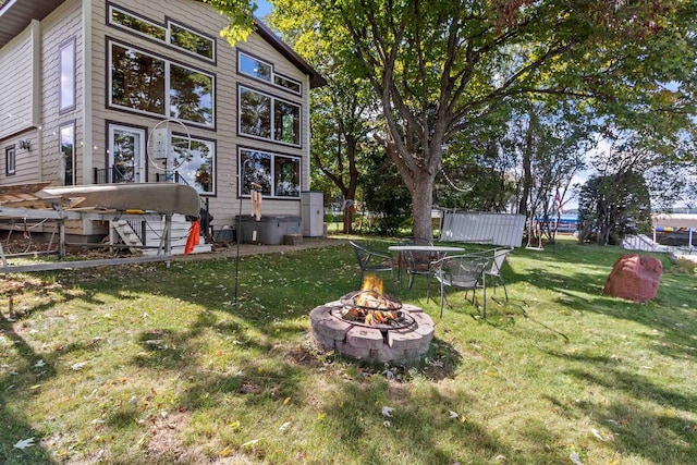 W3084 Blackbird Point Dr, Green Lake, WI 53946 - view of green lawn featuring an outdoor fire pit
