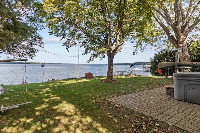 W3084 Blackbird Point Dr, Green Lake, WI 53946 - view of grassy yard with a water view