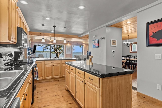 W3084 Blackbird Point Dr, Green Lake, WI 53946 - kitchen featuring stainless steel range with gas cooktop, light wood-style flooring, recessed lighting, light brown cabinets, and a peninsula
