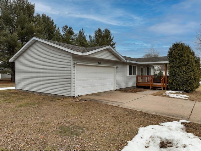 view of home's exterior with a garage and driveway