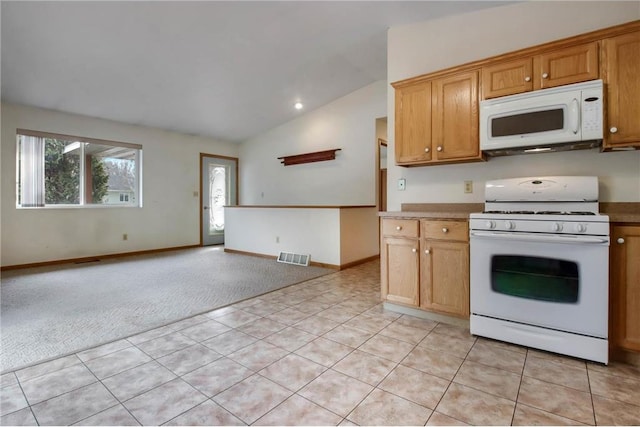 kitchen with lofted ceiling, light colored carpet, white appliances, visible vents, and open floor plan