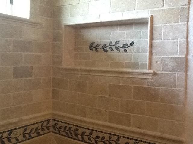 bathroom with tiled shower