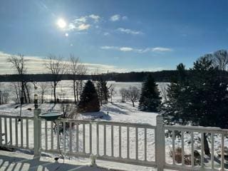 view of snow covered deck