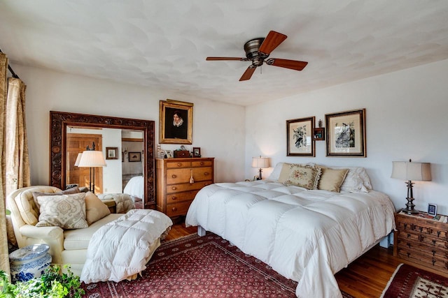 bedroom featuring wood finished floors and a ceiling fan