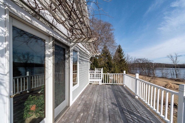 wooden deck featuring a water view