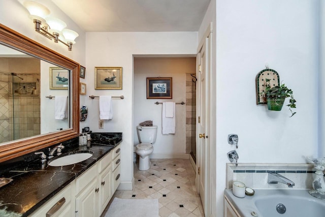 full bathroom with a garden tub, toilet, a shower stall, baseboards, and vanity