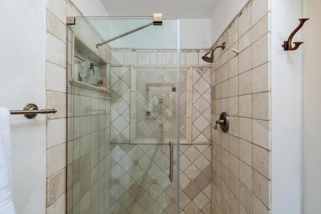 bathroom with a shower stall