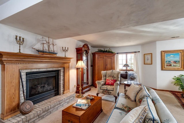 living room featuring visible vents, light colored carpet, a fireplace, and baseboards