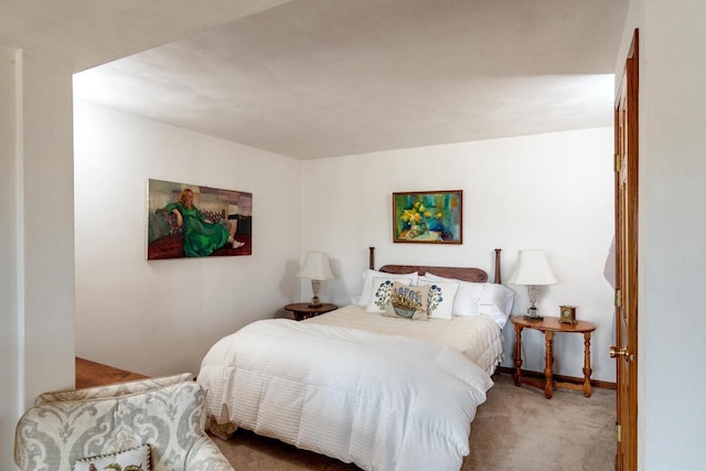 bedroom featuring baseboards and carpet floors