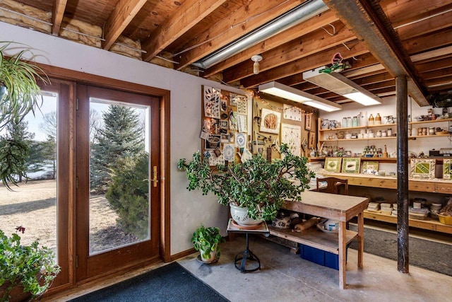 interior space with unfinished concrete flooring