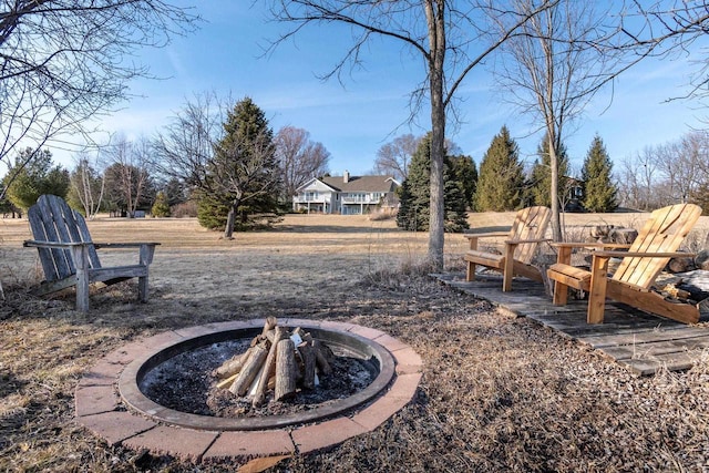 view of yard featuring an outdoor fire pit