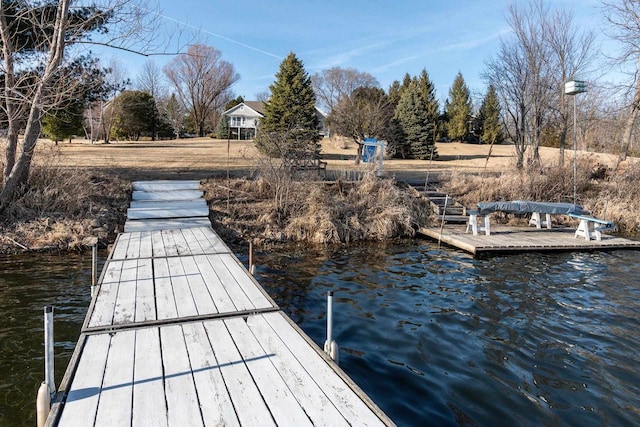 view of dock with a water view