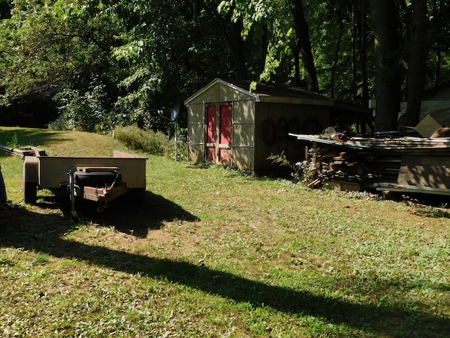 view of yard with an outbuilding and a storage shed