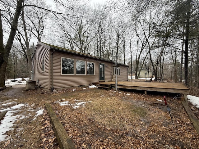 view of front of house with a deck and central AC unit