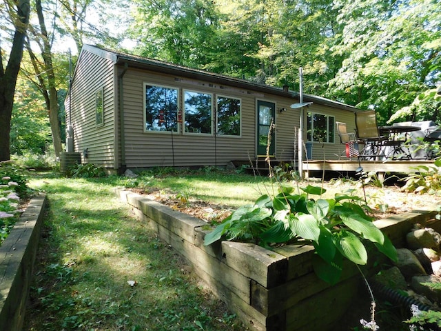 view of front facade with a wooden deck