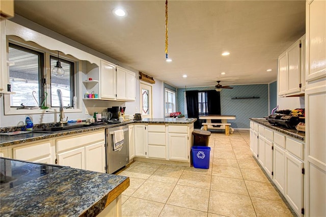 kitchen with light tile patterned floors, a peninsula, stainless steel dishwasher, a sink, and recessed lighting