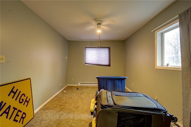 miscellaneous room featuring carpet floors, a baseboard radiator, and baseboards