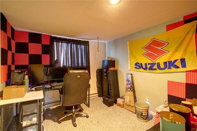 carpeted office with a textured ceiling and baseboards