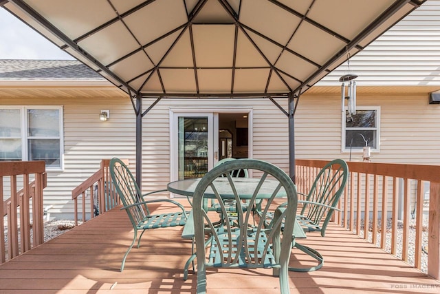 deck featuring outdoor dining area