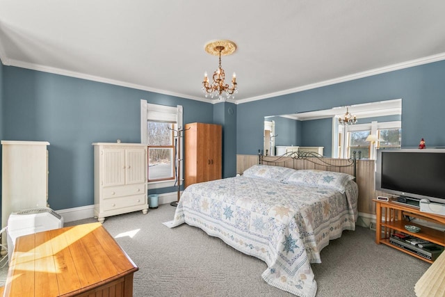 carpeted bedroom featuring crown molding, baseboards, and a notable chandelier